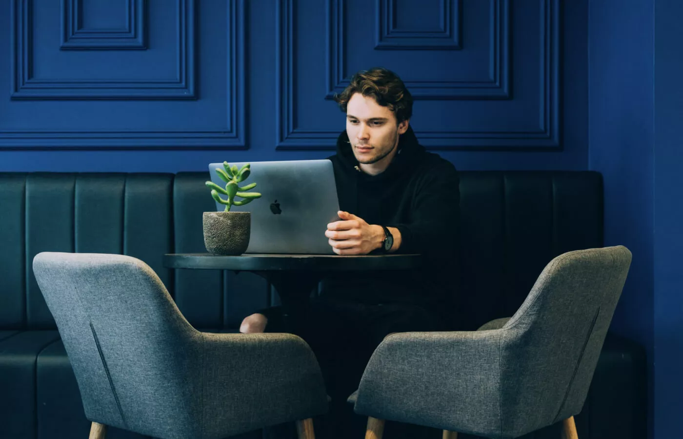 A man sitting on a laptop